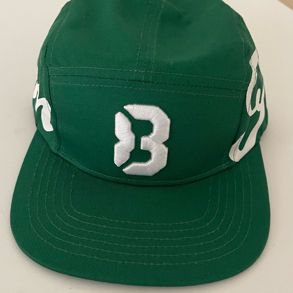 Green Cap with White Letters